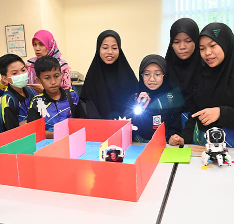 Group of students learning robotics